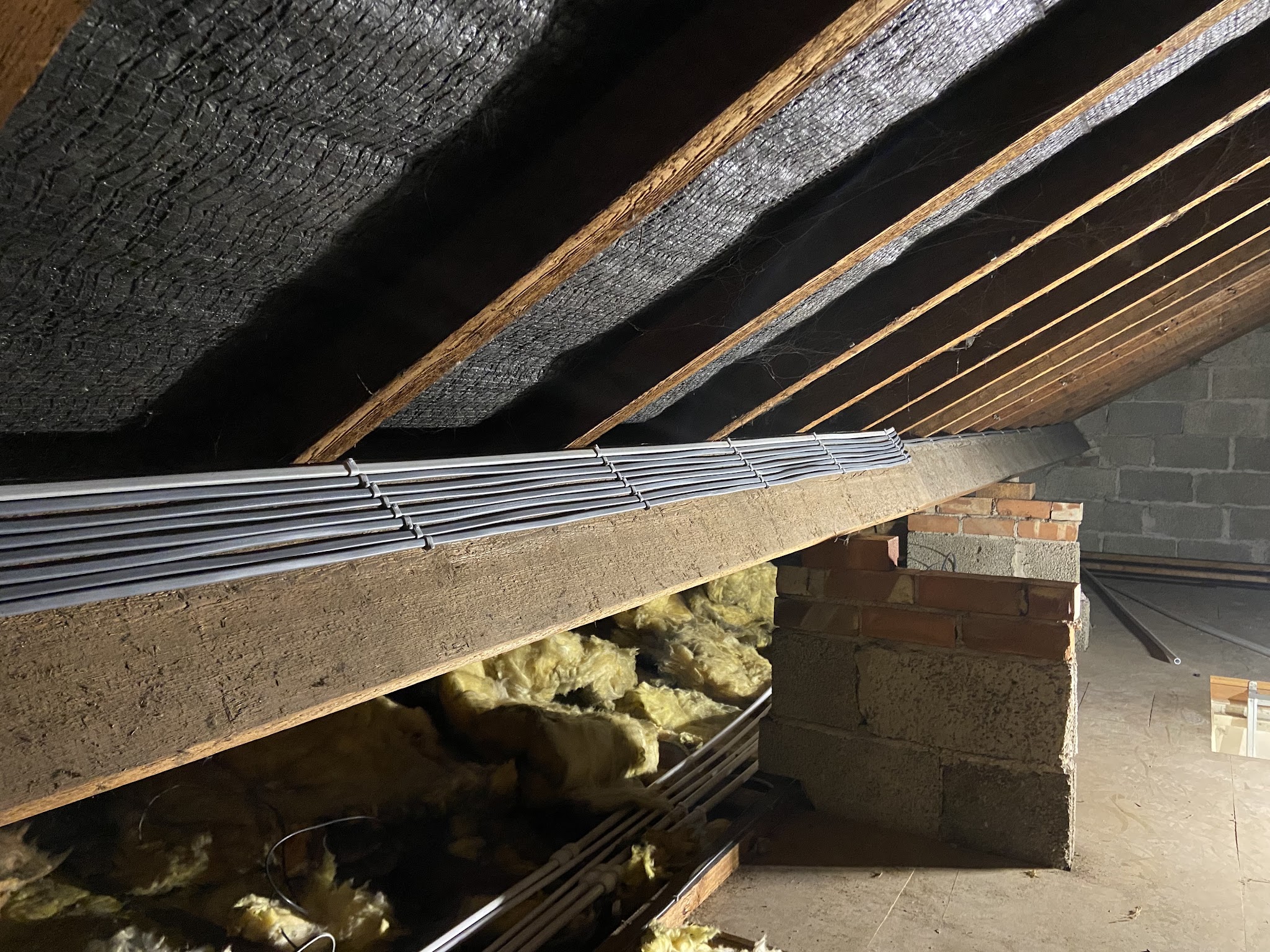 Cable tray run along the joists in a loft
